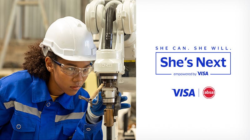 Woman in a helmet at a machine